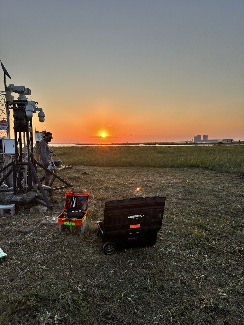 Acoustics equipment in the foreground with sunset behind